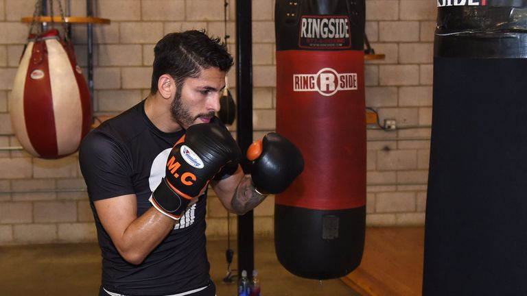 LAS VEGAS, NV - AUGUST 06:  Boxer Jorge Linares hits a heavy bag during a media workout at Barry's Gym on August 6, 2014 in Las Vegas, Nevada. Linares will