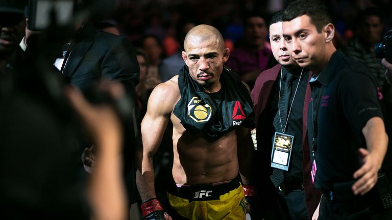 Jose Aldo leaves the Octagon after his fight with Frankie Edgar at UFC 200