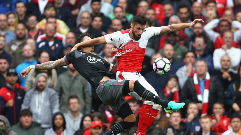 Jose Fonte grabs Olivier Giroud's shirt in the late penalty incident at the Emirates