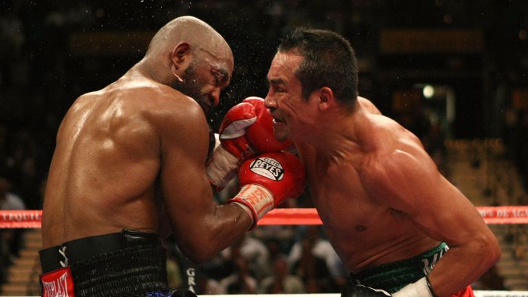 LAS VEGAS - SEPTEMBER 13:  Joel Casamayor (L) trades blows with Juan Manuel Marquez during their bout at the MGM Grand Garden Arena September 13, 2008 in L