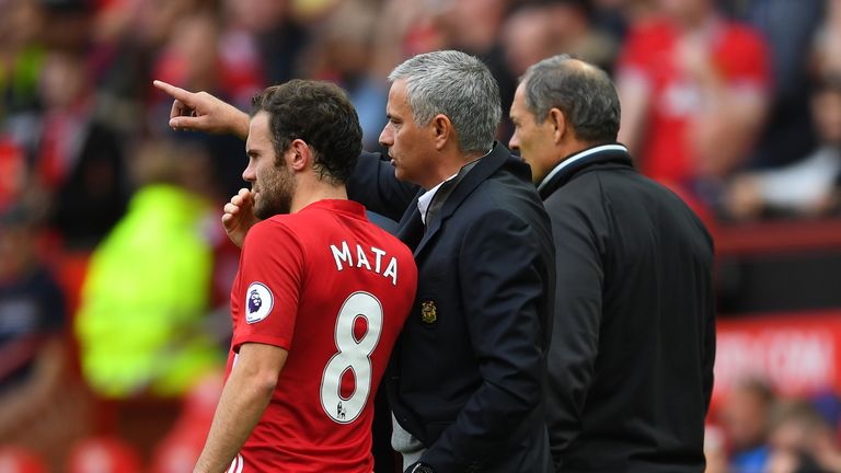 Jose Mourinho gives Juan Mata of Manchester United instructions