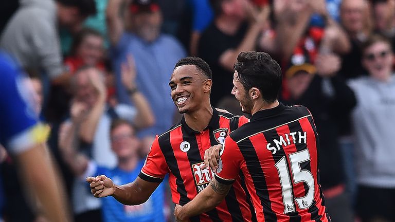 Bournemouth's Junior Stanislas (L) celebrates with Adam Smith after scoring his team's first goal during 