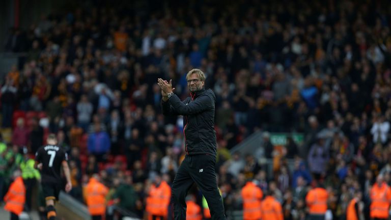 Liverpool's German manager Jurgen Klopp congratulates his players following the English Premier League football match between Liverpool and Hull City at An