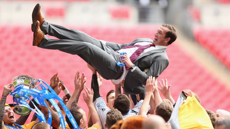 Justin Edinburgh celebrates with Newport County after winning the Blue Square Bet Premier Conference Play-off Final against Wrexham in 2013
