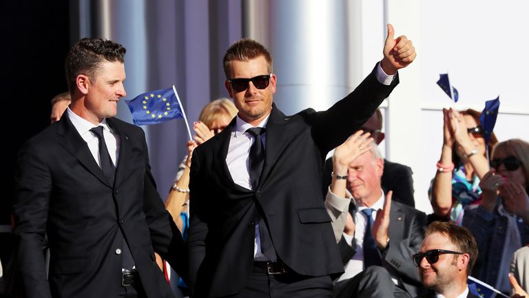 CHASKA, MN - SEPTEMBER 29:  Justin Rose (L) and Henrik Stenson of Europe react during the 2016 Ryder Cup Opening Ceremony at Hazeltine National Golf Club o