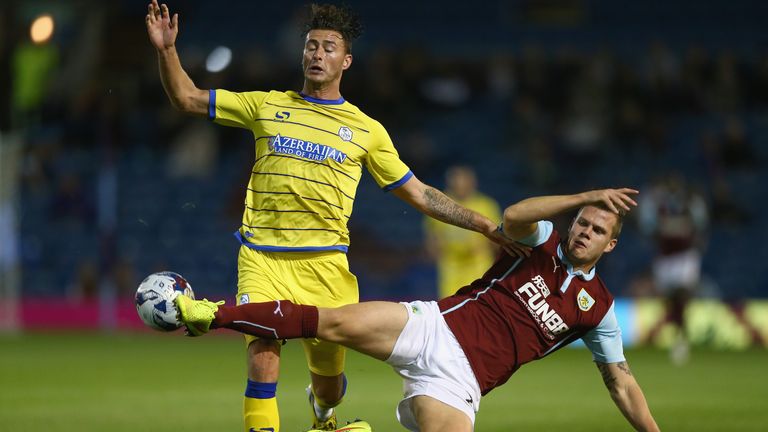 BURNLEY, ENGLAND - AUGUST 26:  Gary Madine of Sheffield Wednesday in action with Kevin Long of Burnley during the Capital One Cup Second Round match betwee