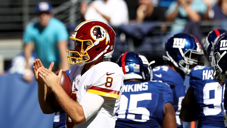 EAST RUTHERFORD, NJ - SEPTEMBER 25:   Kirk Cousins #8 of the Washington Redskins tries to call time out before the clock expires in the second quarter agai