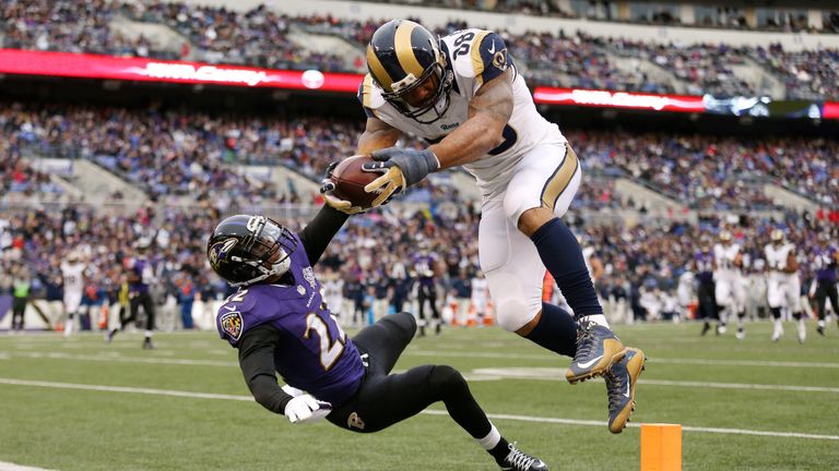 BALTIMORE, MD - NOVEMBER 22: Tight end Lance Kendricks #88 of the St. Louis Rams scores a third quarter touchdown past cornerback Jimmy Smith #22 of the Ba