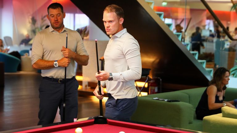 Danny Willett (R) and Lee Westwood relax before flying to the United States