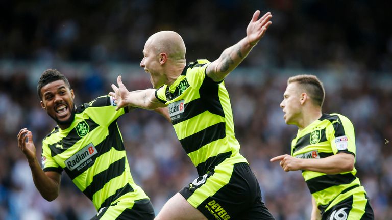 Aaron Mooy celebrates after scoring Huddersfield's winner