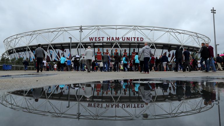 LONDON, ENGLAND - SEPTEMBER 10:  Spectators walk to the stadium before the Premier League match between West Ham United and Watford at the Olympic Stadium 