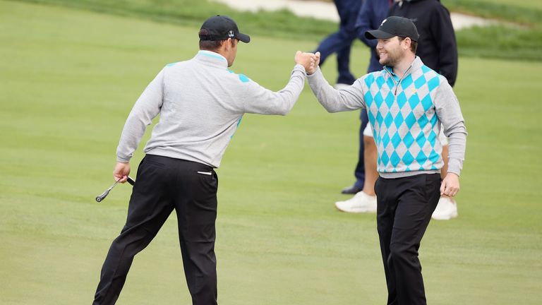 INCHEON CITY, SOUTH KOREA - OCTOBER 10:  Louis Oosthuizen and Branden Grace of South Africa and the Internaional Team celebrate on the 16th green after def