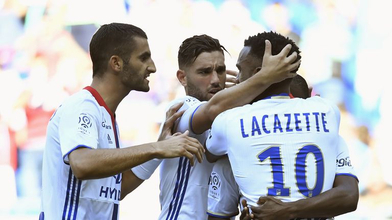 Alexandre Lacazette (R) is congratuated by teammates after scoring during for Lyon against Bordeaux