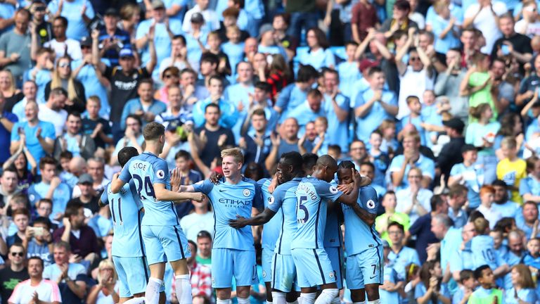 Raheem Sterling of Manchester City celebrates scoring his side's third goal