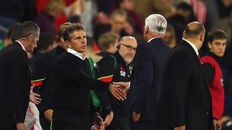 Alan Pardew, Manager of Crystal Palace shakes hands with Claude Puel, Manager of Southampton