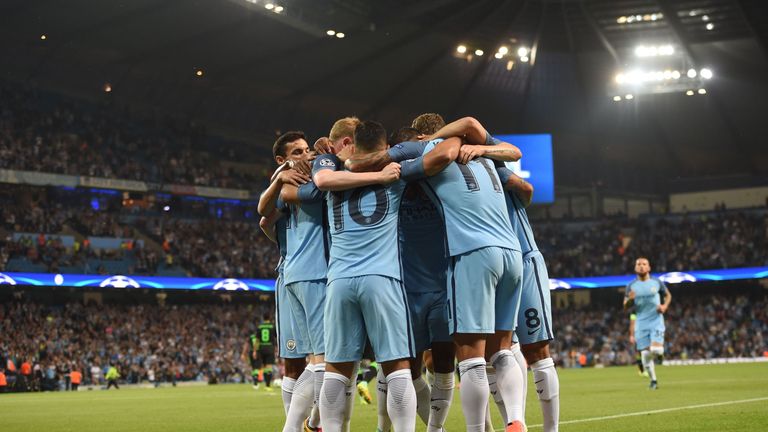 Manchester City players celebrate after Sergio Aguero (C) scored the opening goal