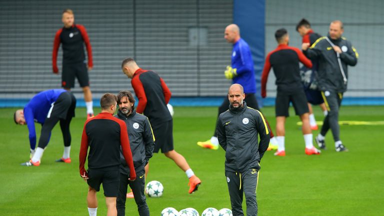 Pep Guardiola manager of Manchester City looks on during a training session on the eve of their UEFA Champions League clash with Celtic