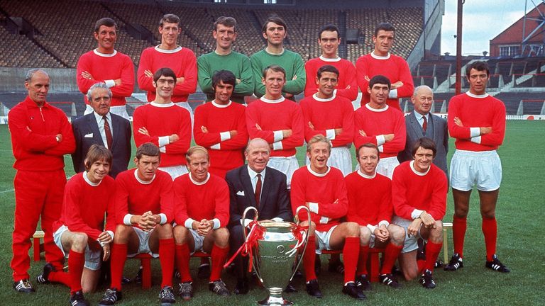 The Manchester United squad line up with manager Matt Busby and the European Cup in July 1968