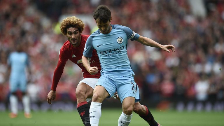 David Silva holds off Marouane Fellaini