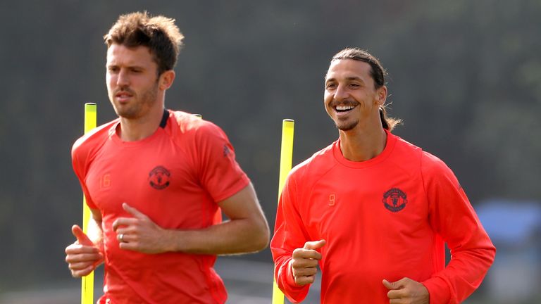 Manchester United's Zlatan Ibrahimovic (R) and Michael Carrick during a training session at Aon Training Complex