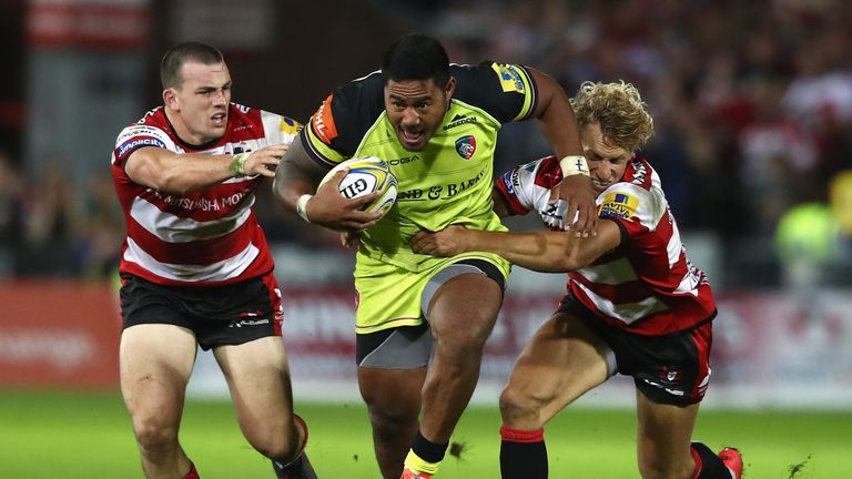 GLOUCESTER, ENGLAND - SEPTEMBER 02:  Manu Tulagi of Leicester is tackled by Matt Scott (L) and Billy Twelvetrees during the Aviva Premiership match between