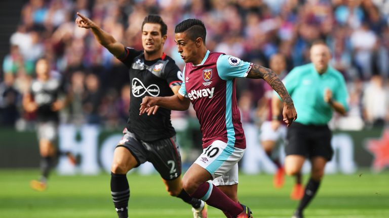 Manuel Lanzini of West Ham United is chased by Cedric Soares of Southampton during the Premier League match at the London Stadium