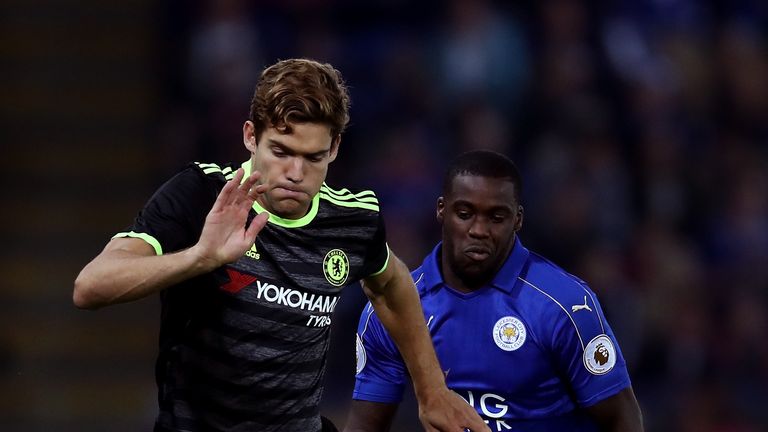 Marcos Alonso of Chelsea is closed down by Jeffrey Schlupp of Leicester City during the EFL Cup Third Round match at the King Power Stadium