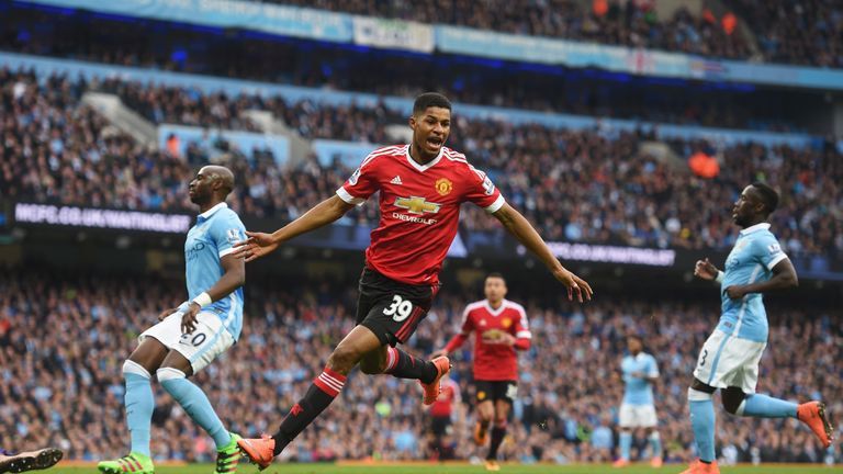 MANCHESTER, ENGLAND - MARCH 20:  Marcus Rashford of Manchester United celebrates as he scores their first goal during the Barclays Premier League match bet