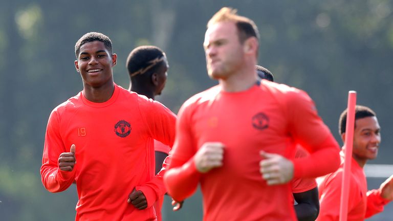 Marcus Rashford (L) and Wayne Rooney during a training session at the Aon Training Complex
