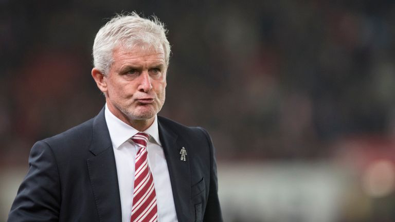 Mark Hughes manager of Stoke City looks on