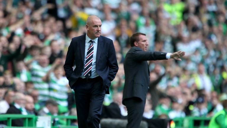 Rangers manager Mark Warburton (left) and Celtic manager Brendan Rodgers on the touchline during the Ladbrokes Scottish Premiership match at Celtic Park, G
