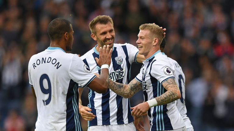Fames McClean of West Bromwich Albion (R) celebrates scoring his sides third goal