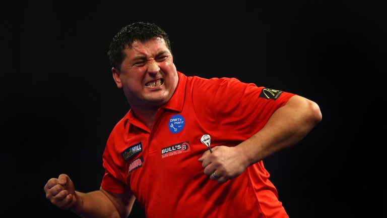 LONDON, ENGLAND - DECEMBER 20: Mensur Suljovic of Austria celebrates winning his first round match against Jermaine Wattimena of Holland during the 2016 Wi