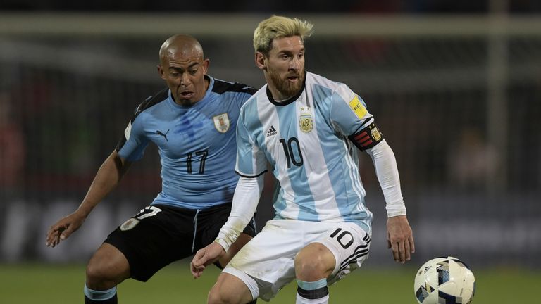 Argentina's Lionel Messi and Uruguay's Egidio Arevalo Rios vie for the ball during the FIFA World Cup 2018 qualifier football match between Argentina and U