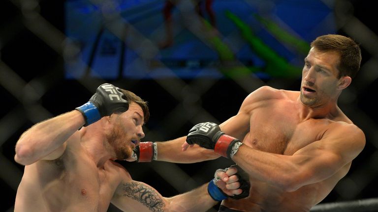 INGLEWOOD, CA - JUNE 04: Michael Bisping (blue gloves) and Luke Rockhold (red gloves) during their middleweight championship bout at UFC 199 at The Forum o