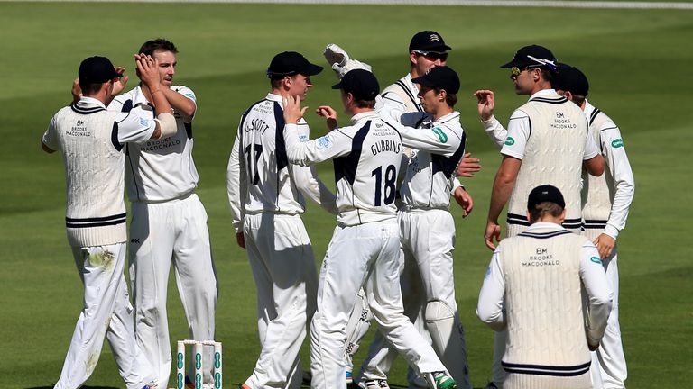 BIRMINGHAM, ENGLAND - SEPTEMBER 1:  Toby Roland-Jones (2 L) of Middlesex celebrates after he takes the wicket of Jonathan Trott of Warwickshire during day 