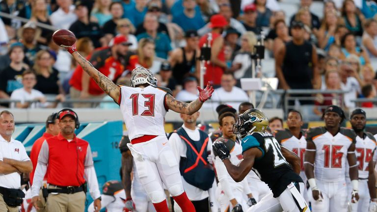 JACKSONVILLE, FL - AUGUST 20: Jalen Ramsey #20 of the Jacksonville Jaguars looks up as Mike Evans #13 of the Tampa Bay Buccaneers is unable to catch the ba