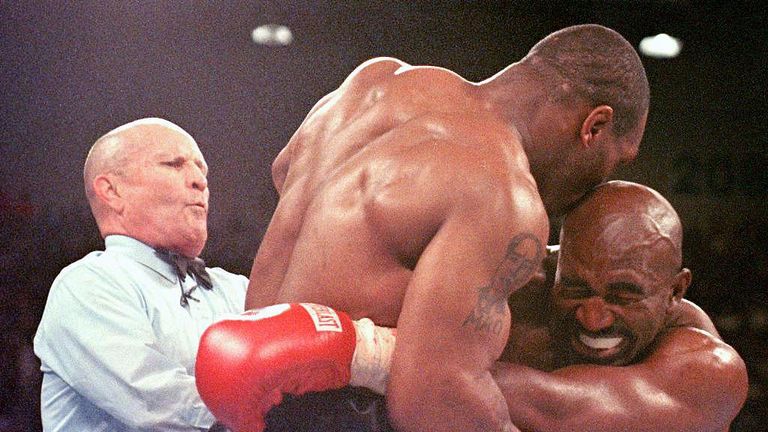  Referee Lane Mills (L) steps in as Evander Holyfield (R) reacts after Mike Tyson bit his ear