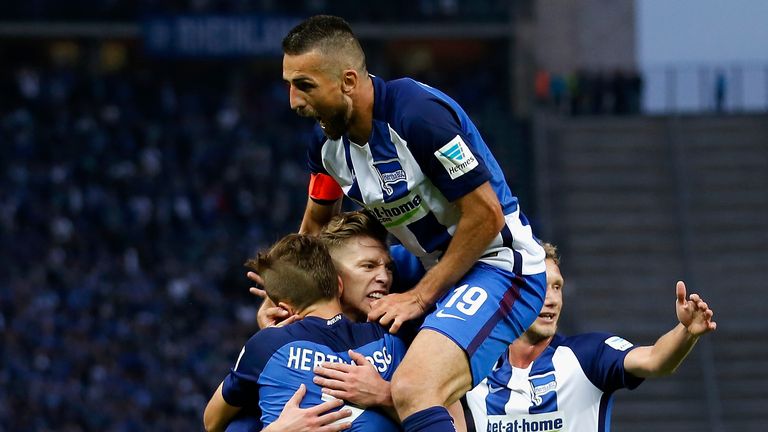 Mitchell Weiser (2.L) celebrates with team-mates after scoring his team's first goal during the Bundesliga match between Hertha BSC and FC Schalke 04