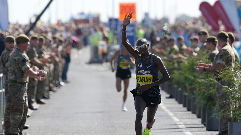 Great Britain's Mo Farah crosses the finish line to win the Great North Run, celebrating in Alan Shearer style