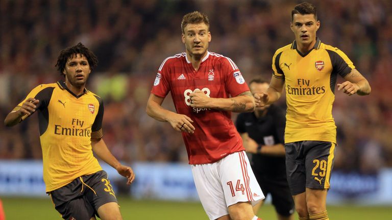 (left-right) Arsenal's Mohamed Elneny, Nottingham Forest's Nicklas Bendtner, and Arsenal's Granit Xhaka in action during the EFL Cup, Third Round match at 