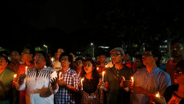 Mourners observe a minute's silence at Shaheed Minar for the victims of the Gulshan cafe tragedy in Dhaka in July