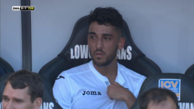 Neil Taylor was not happy to be substituted in the first half
