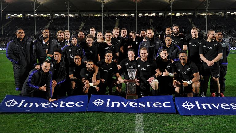 New Zealand players celebrate winning the Freedom Cup after their win over South Africa during the rugby Test match between New Zealand and South Africa at