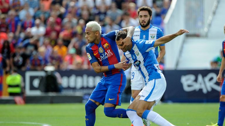 Barcelona's Neymar vies with Leganes defender Victor Diaz during the La Liga clash