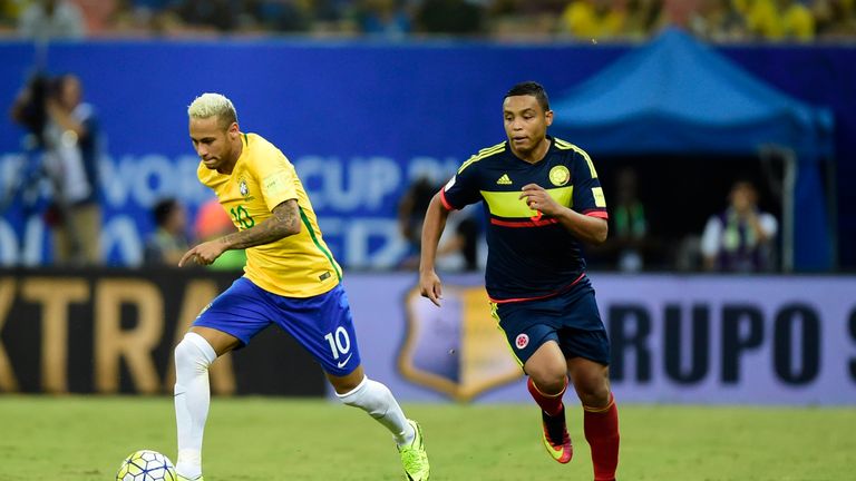 Neymar [left] breaks clear of the Colombia defence