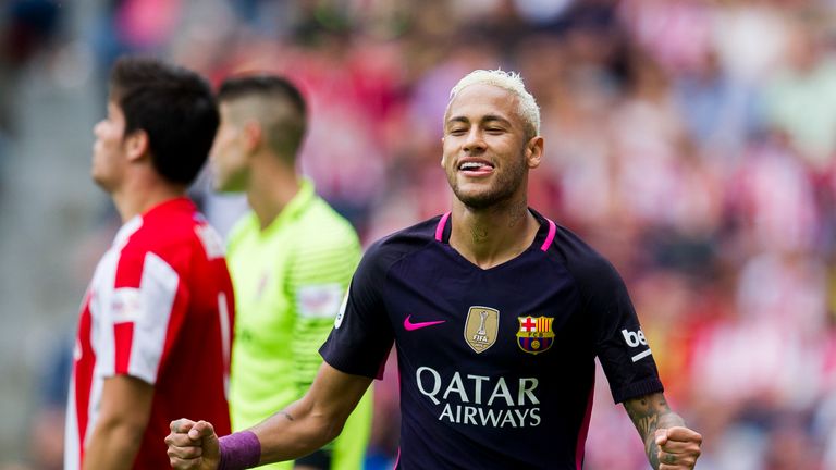 Neymar of FC Barcelona celebrates after scoring his team's third goal during the La Liga match between Real Sporting de Gijon