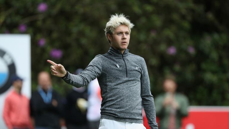 VIRGINIA WATER, ENGLAND - MAY 25:  Niall Horan of One Direction reacts to a shot during the Pro-Am prior to the BMW PGA Championship at Wentworth on May 25