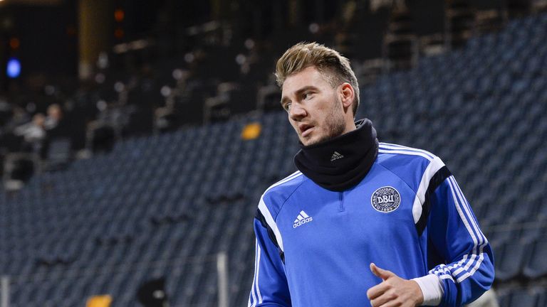 Denmark's national football team player forward Nicklas Bendtner warms up during a training session at the Friends Arena in Solna, near Stockholm on Novemb