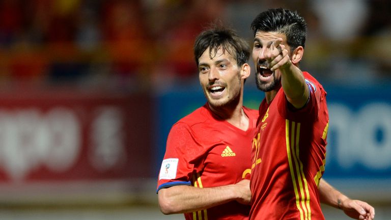 Spain's midfielder David Silva (L) celebrates with teammate forward Nolito